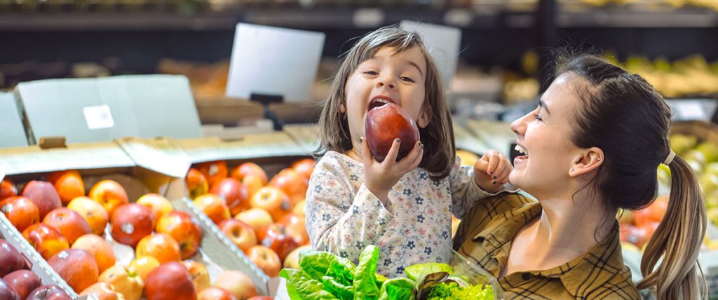 Retail Valuation Services - Mother and child at grocery store.